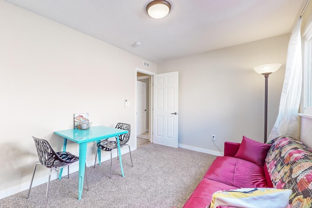 office space with visible vents, baseboards, and carpet flooring