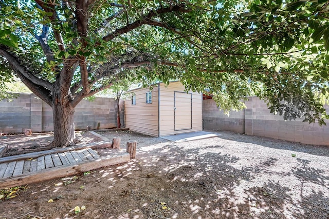 view of shed with a fenced backyard