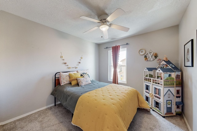 bedroom with baseboards, a textured ceiling, ceiling fan, and carpet flooring