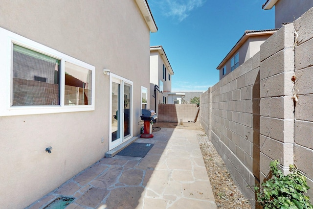 view of patio / terrace featuring fence