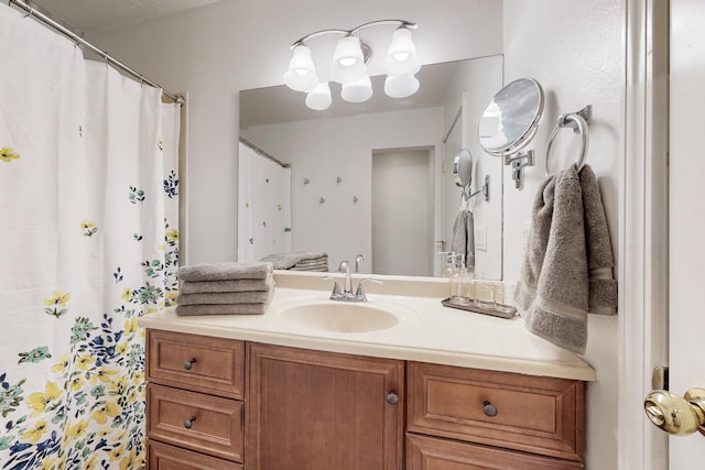 bathroom with a shower with curtain and vanity