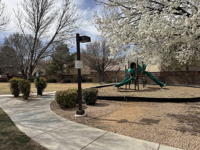 communal playground featuring fence