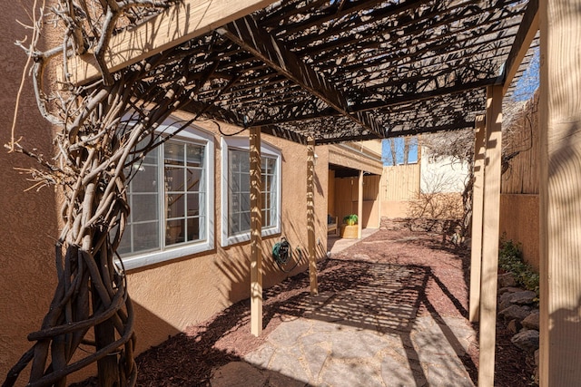 view of patio with fence and a pergola