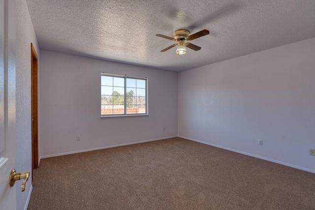 empty room with carpet flooring, ceiling fan, a textured ceiling, and baseboards