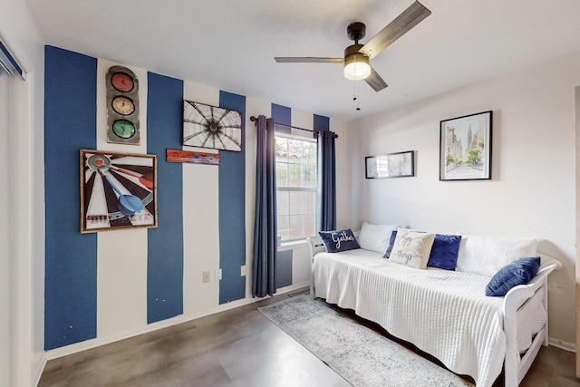 bedroom with concrete flooring, ceiling fan, and baseboards