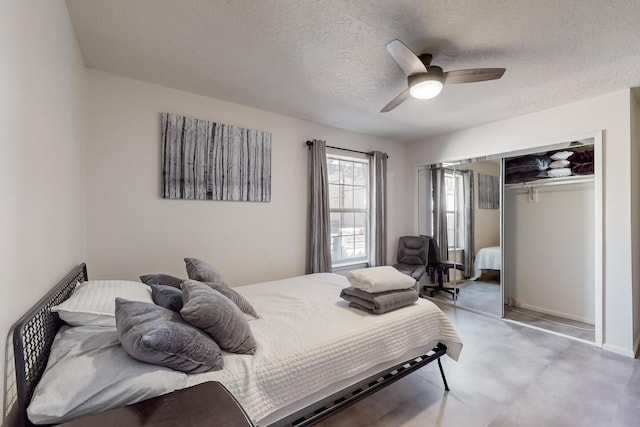 bedroom featuring a ceiling fan, a closet, a textured ceiling, and baseboards