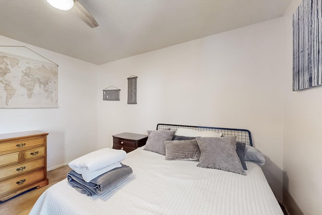 bedroom with light colored carpet and ceiling fan