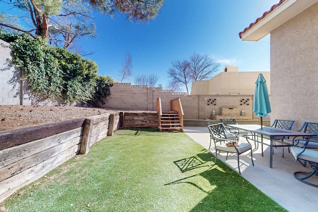 view of yard with a patio and a fenced backyard