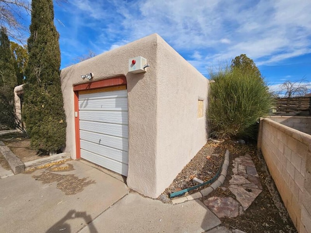 garage with fence