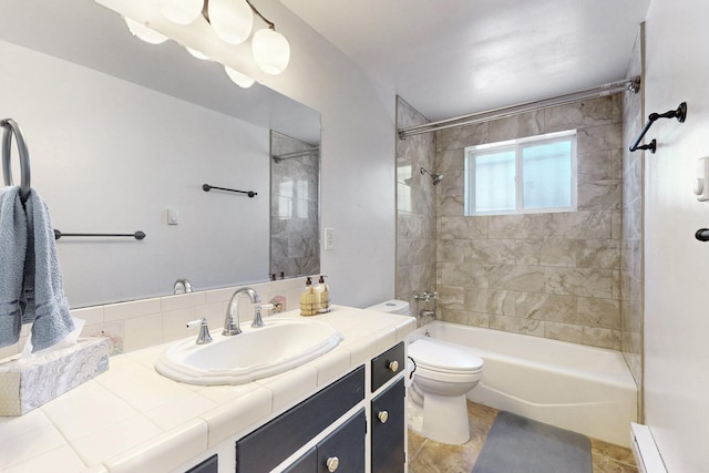 bathroom featuring toilet, washtub / shower combination, baseboard heating, and vanity