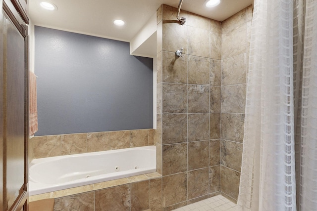 bathroom featuring a jetted tub, a tile shower, and recessed lighting