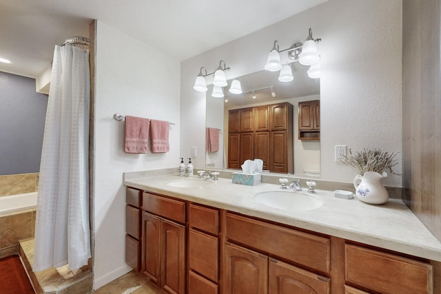 bathroom with double vanity, a shower with shower curtain, and a sink