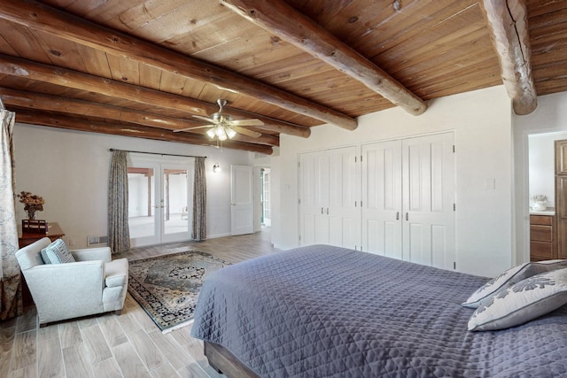 bedroom with wood ceiling, beamed ceiling, french doors, light wood-style floors, and a closet