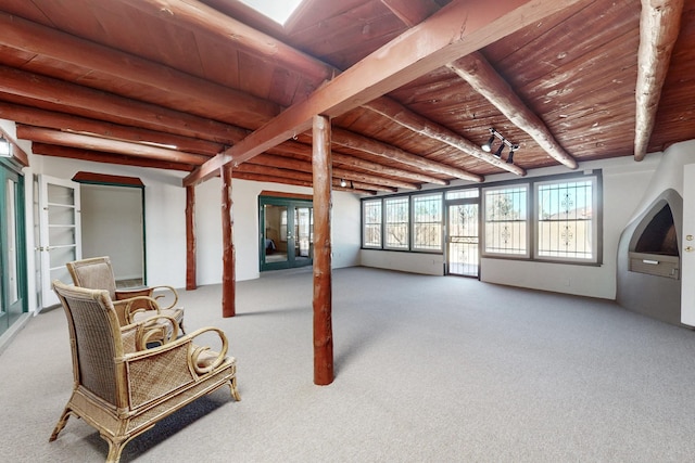 basement featuring carpet floors and wooden ceiling