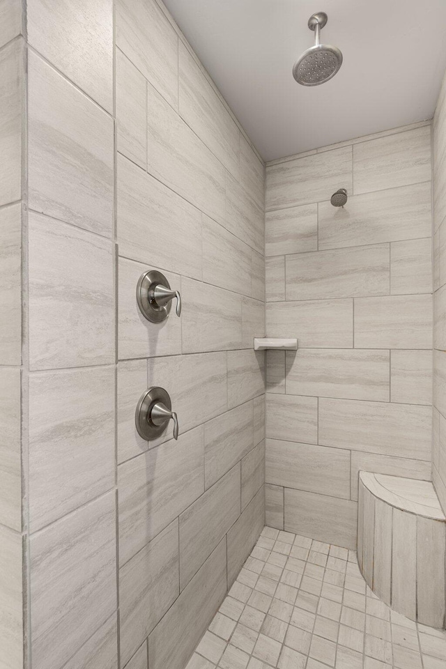 full bath featuring a tile shower