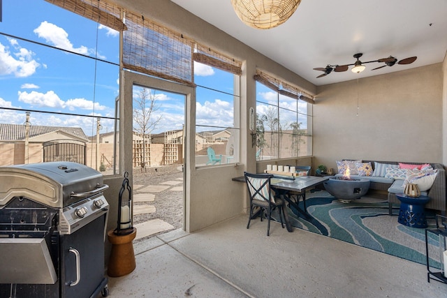 sunroom with a ceiling fan