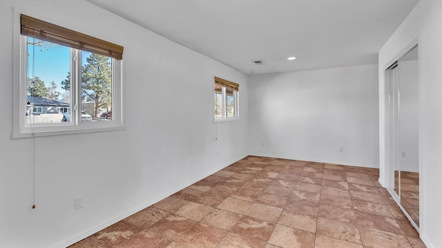 unfurnished bedroom featuring baseboards, visible vents, and recessed lighting