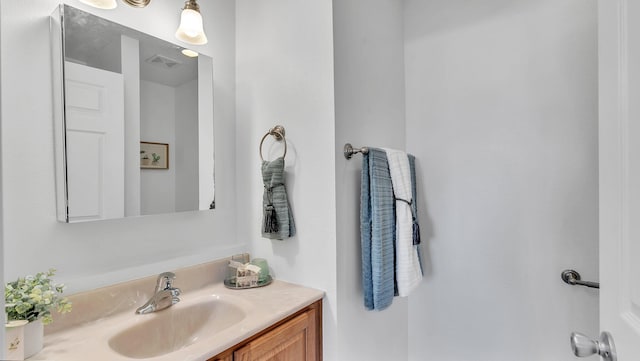 bathroom with visible vents and vanity