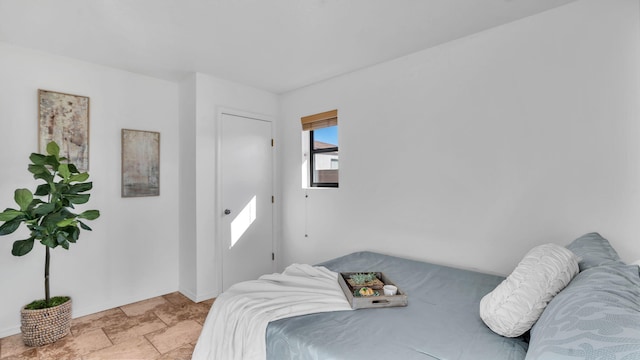 bedroom with stone finish floor