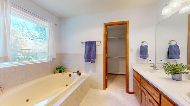 full bath featuring a whirlpool tub, double vanity, and a sink