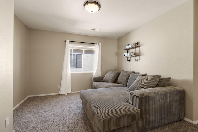 living area featuring carpet flooring, visible vents, and baseboards