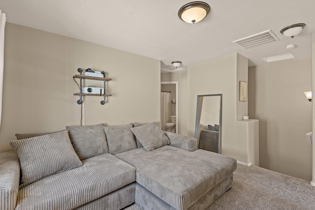 living area with carpet floors and visible vents