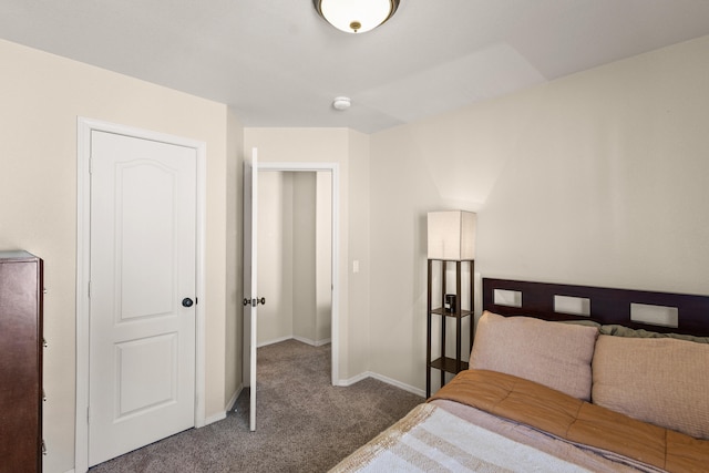 bedroom featuring carpet and baseboards