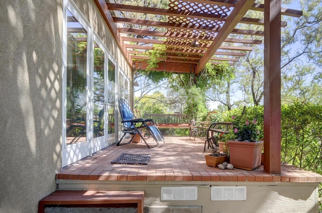 wooden deck with a pergola