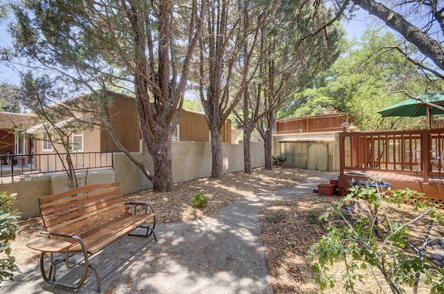 view of yard featuring fence private yard, a patio area, and a deck