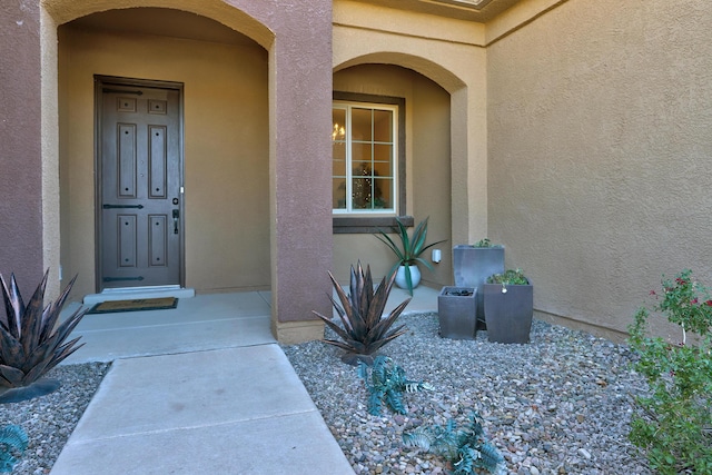 doorway to property with stucco siding