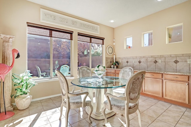 9316 Iron Creek Ln NW, Albuquerque, NM 87120 - dining room featuring light tile patterned flooring, recessed lighting, and tile walls