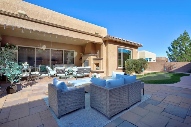 9316 Iron Creek Ln NW, Albuquerque, NM 87120 - view of patio with a putting area and outdoor lounge area