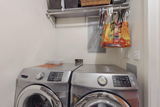 laundry area featuring washing machine and clothes dryer and laundry area