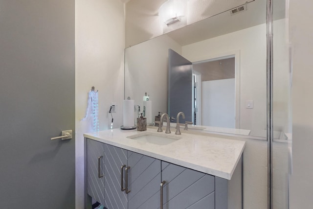 bathroom featuring visible vents and vanity