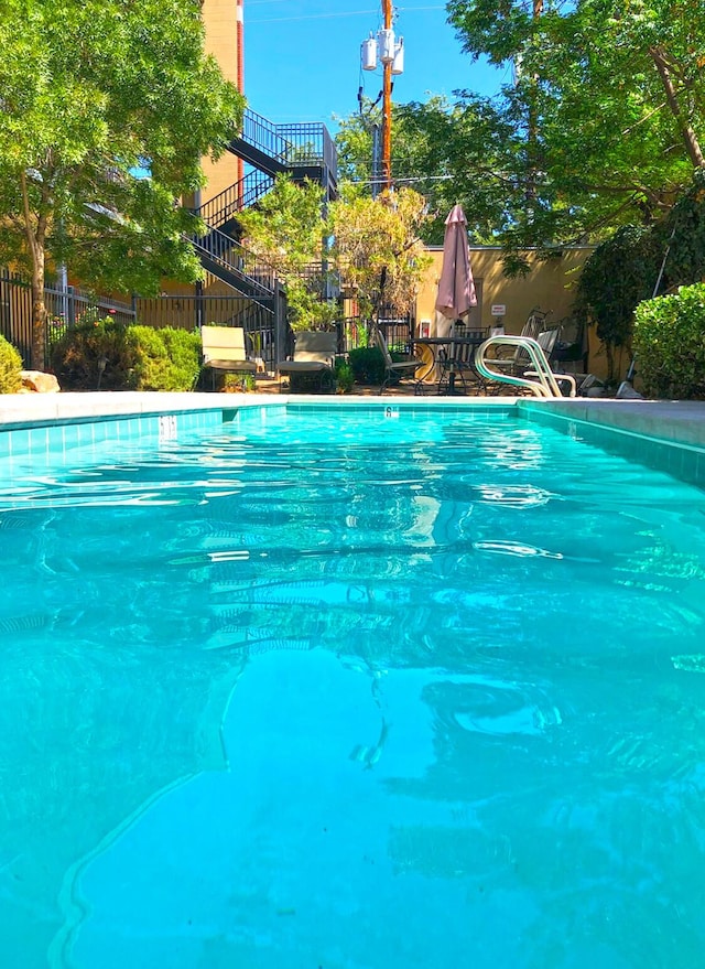 view of pool featuring a fenced in pool and fence