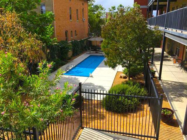 view of pool featuring a patio area, a fenced in pool, and fence