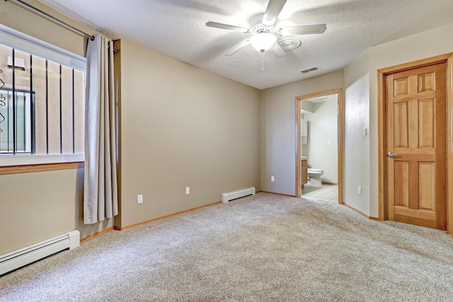 empty room with carpet, a baseboard radiator, a ceiling fan, and a textured ceiling