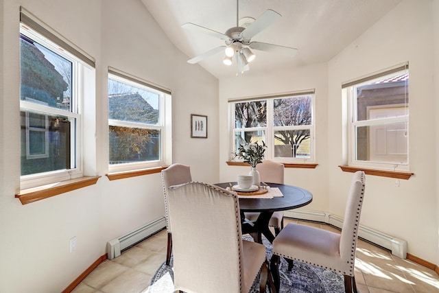 dining area with lofted ceiling, light tile patterned floors, a baseboard radiator, and baseboards