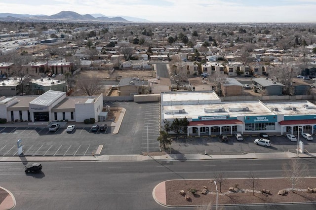 birds eye view of property featuring a mountain view