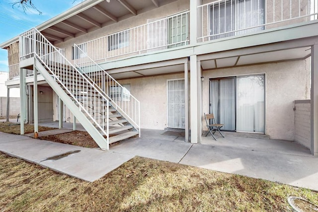 view of patio / terrace featuring stairs