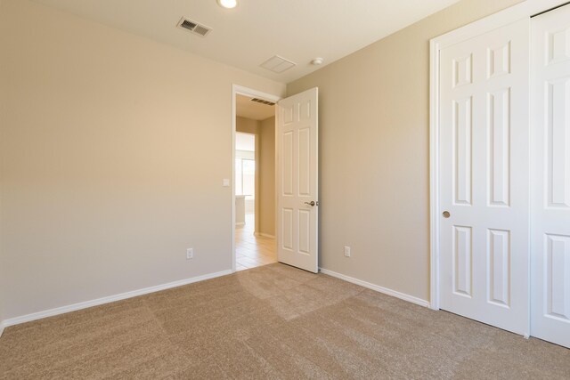 2178 Janet Way, Rio Rancho, NM 87144 - unfurnished bedroom with carpet flooring, baseboards, and a closet