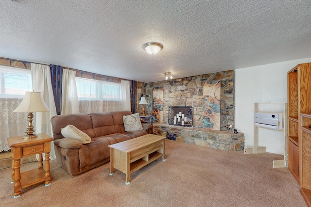 carpeted living area featuring a stone fireplace and a textured ceiling