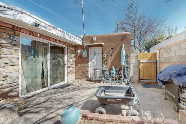 view of patio / terrace with a gate