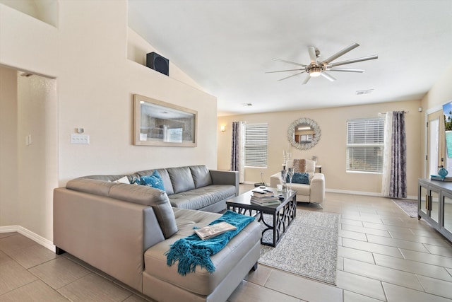 tiled living room featuring ceiling fan, visible vents, and baseboards