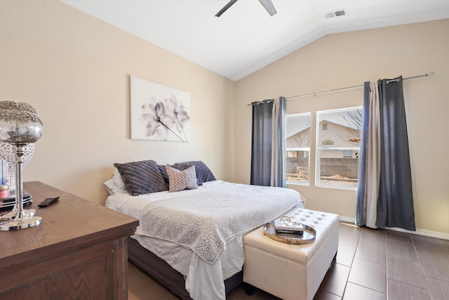 bedroom with visible vents, vaulted ceiling, ceiling fan, tile patterned flooring, and baseboards