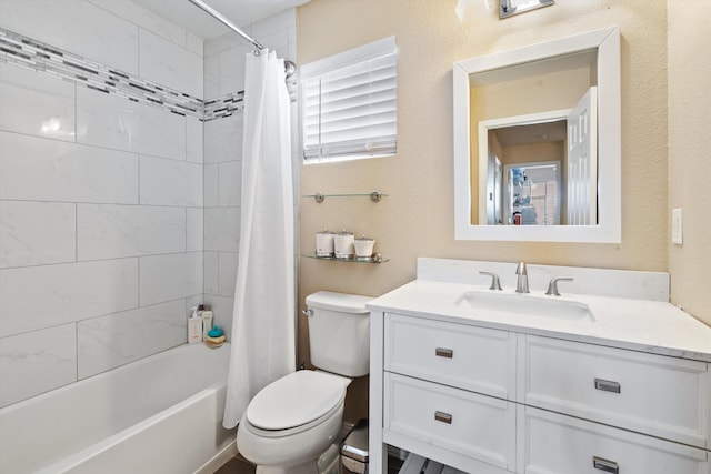 bathroom featuring a textured wall, vanity, toilet, and shower / tub combo with curtain