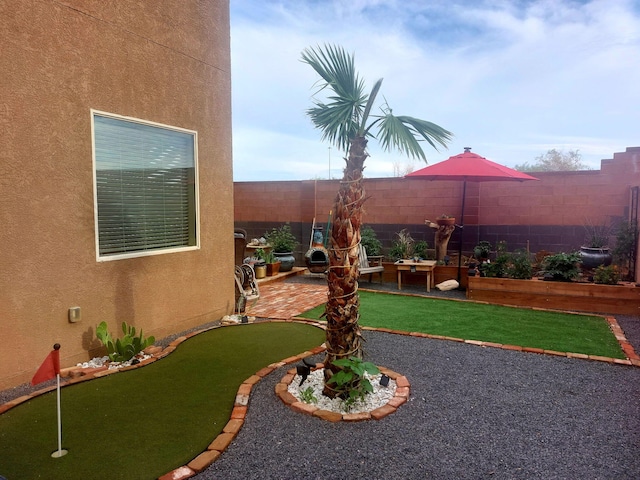 view of yard featuring a patio and a fenced backyard