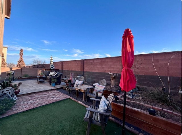 view of patio with a fenced backyard and an outdoor living space