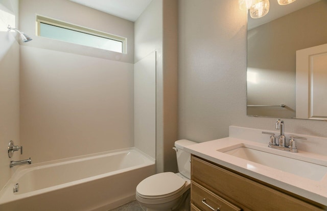 bathroom with washtub / shower combination, vanity, and toilet