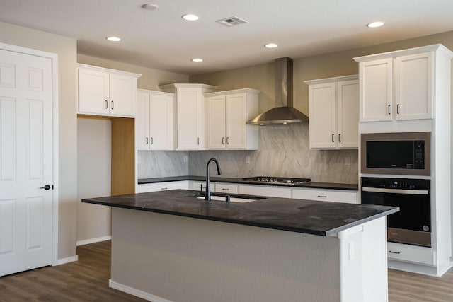 6209 Angelou Ln NW, Albuquerque, NM 87120 - kitchen featuring oven, wall chimney range hood, dark countertops, built in microwave, and a sink